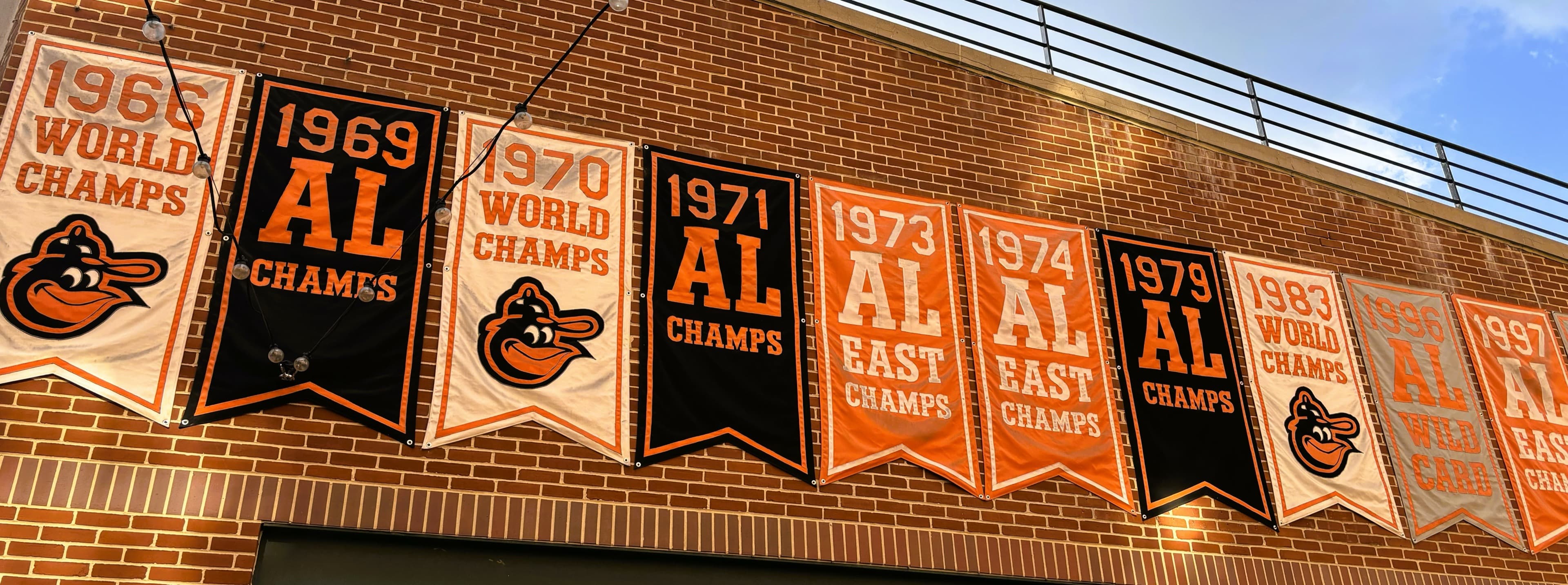 Championship banners on the brick wall at Oriole Park at Camden Yards